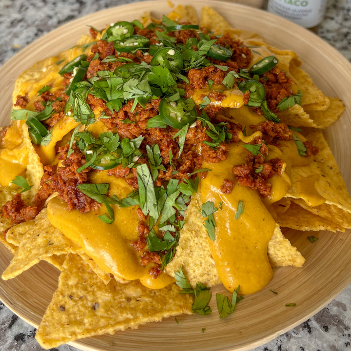 Plant-based nachos with chorizo and taco sauce