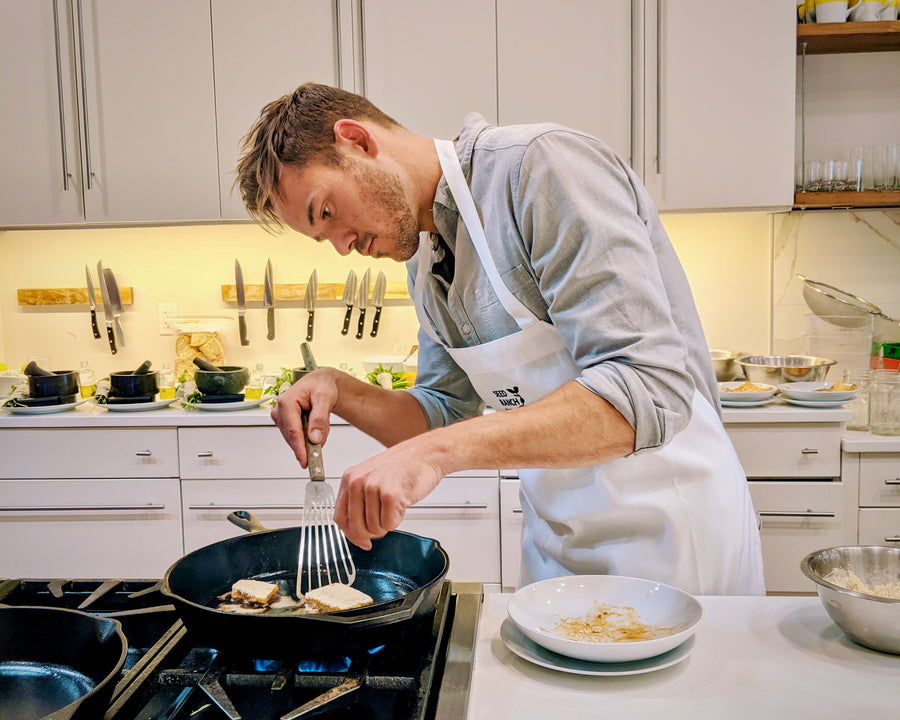 Chief of flavor cooking tofu on cast iron in kitchen