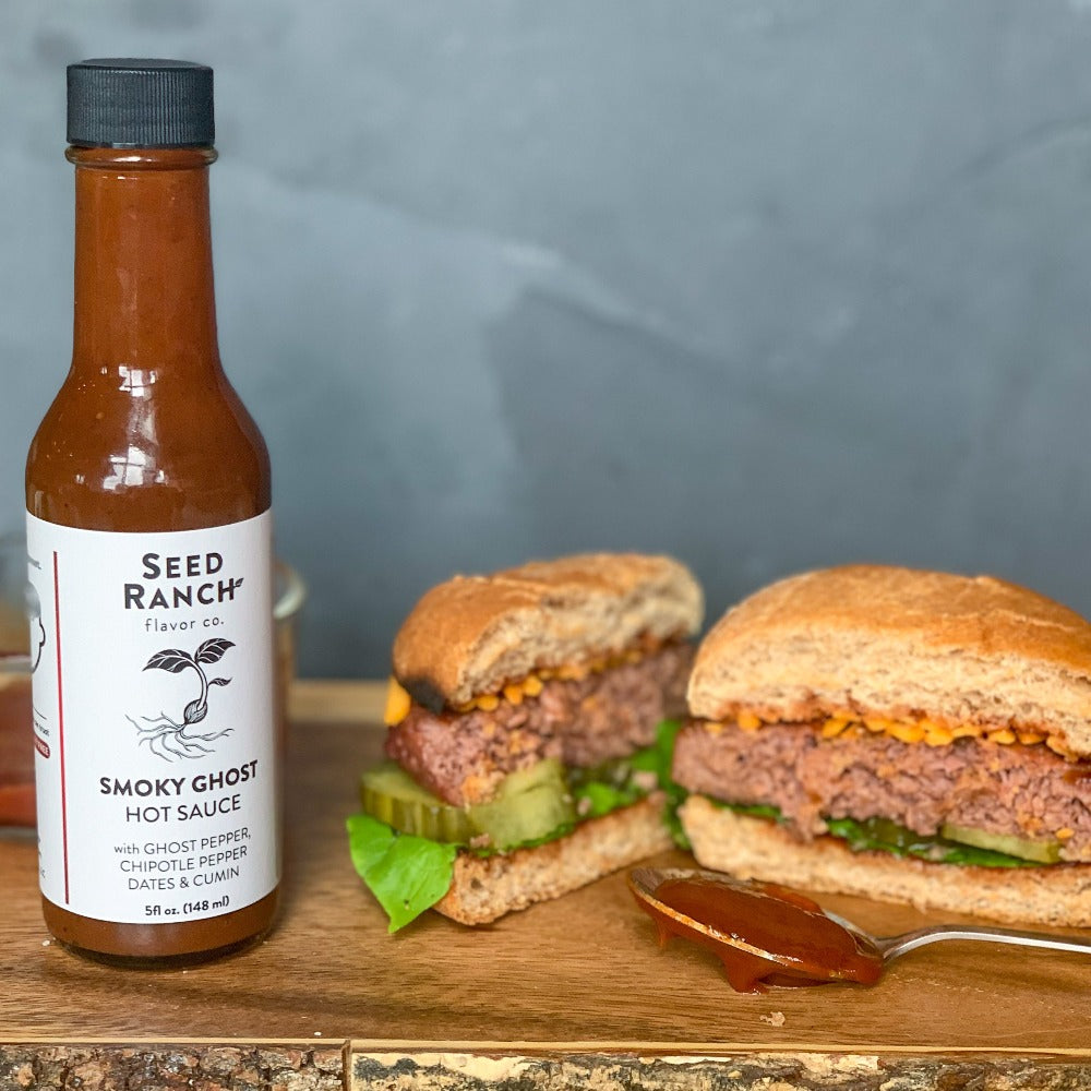 Smoky Ghost Hot Sauce on a plant-based burger