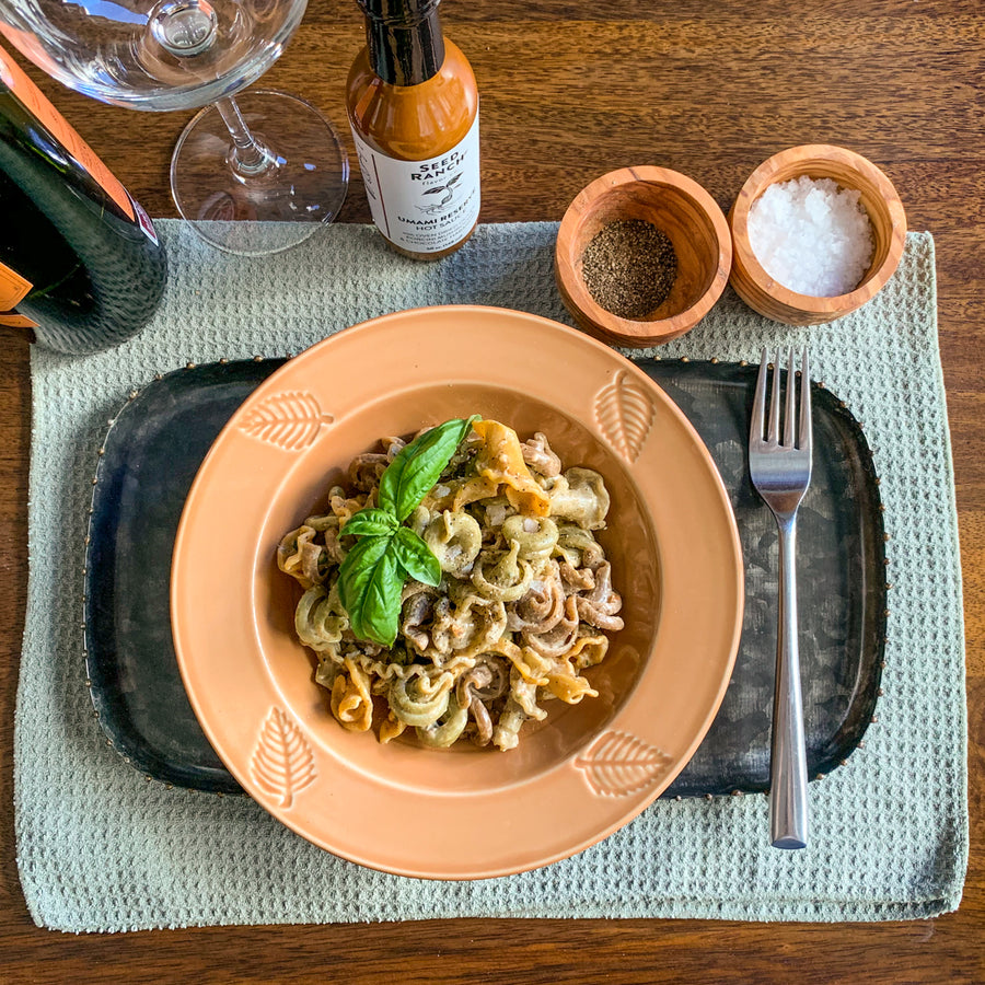 umami reserve hot sauce in plant based pasta dinner