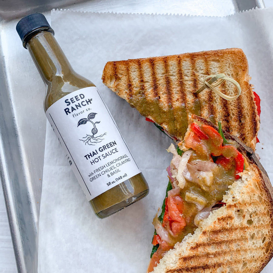 Thai Green Hot Sauce Mild on a vegan sandwich